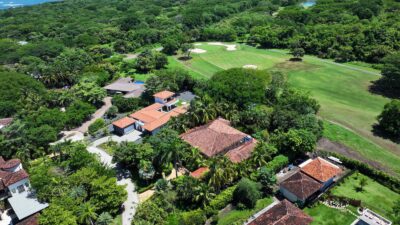 Villa Tuscana aerial view of the home with fairways beyond