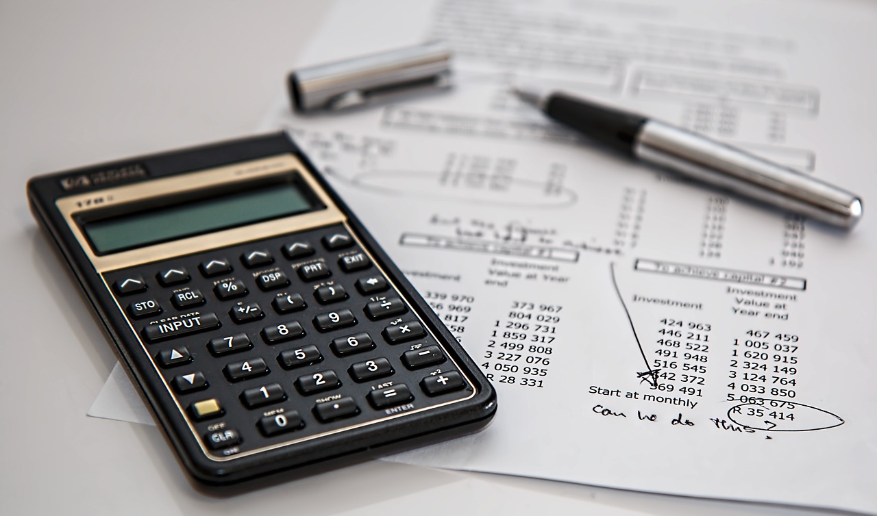 Calculator and pen on a printed tax worksheet