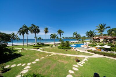 Beachfront real estate in Costa Rica with ocean views, representing investment opportunities for expat buyers