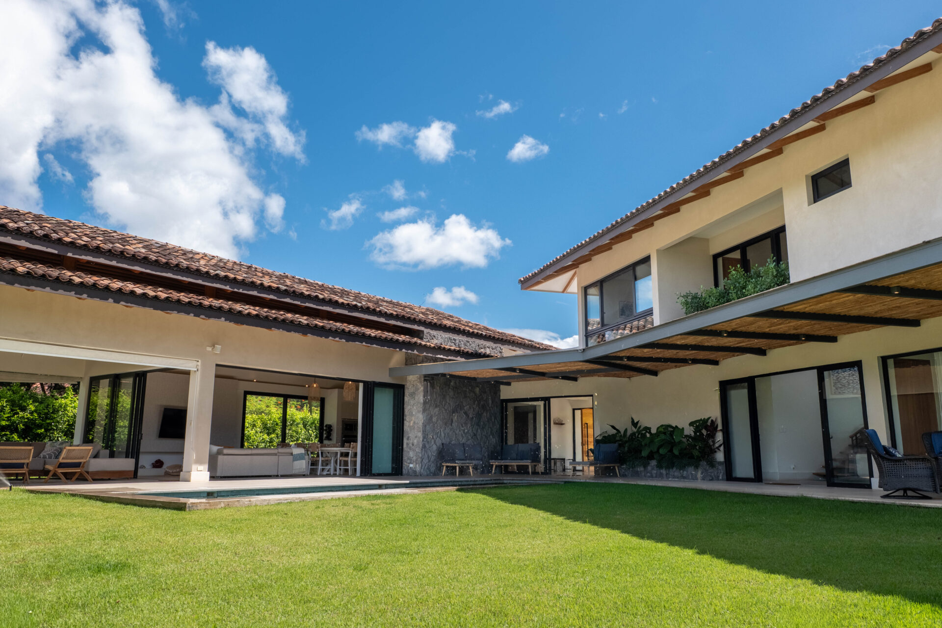 Modern coastal home exterior in Costa Rica with tropical landscaping