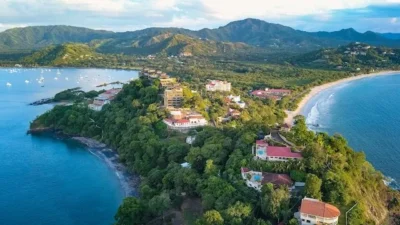 Aerial view of Playa Flamingo Costa Rica white sand beach and calm bay