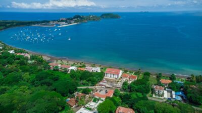 Walkable street in Surfside community with tropical homes