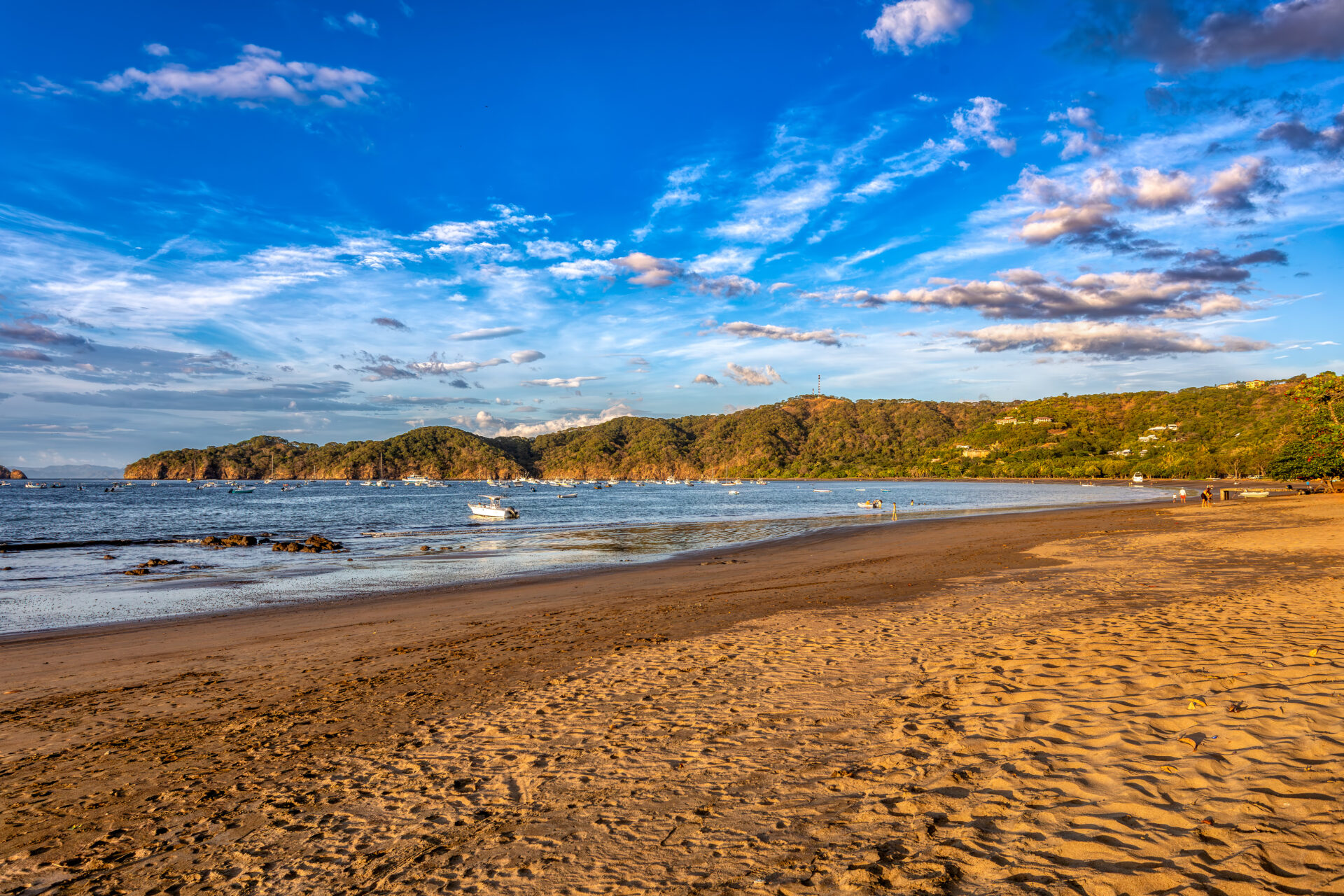 Playas del Coco beach with volcanic sand and calm bay