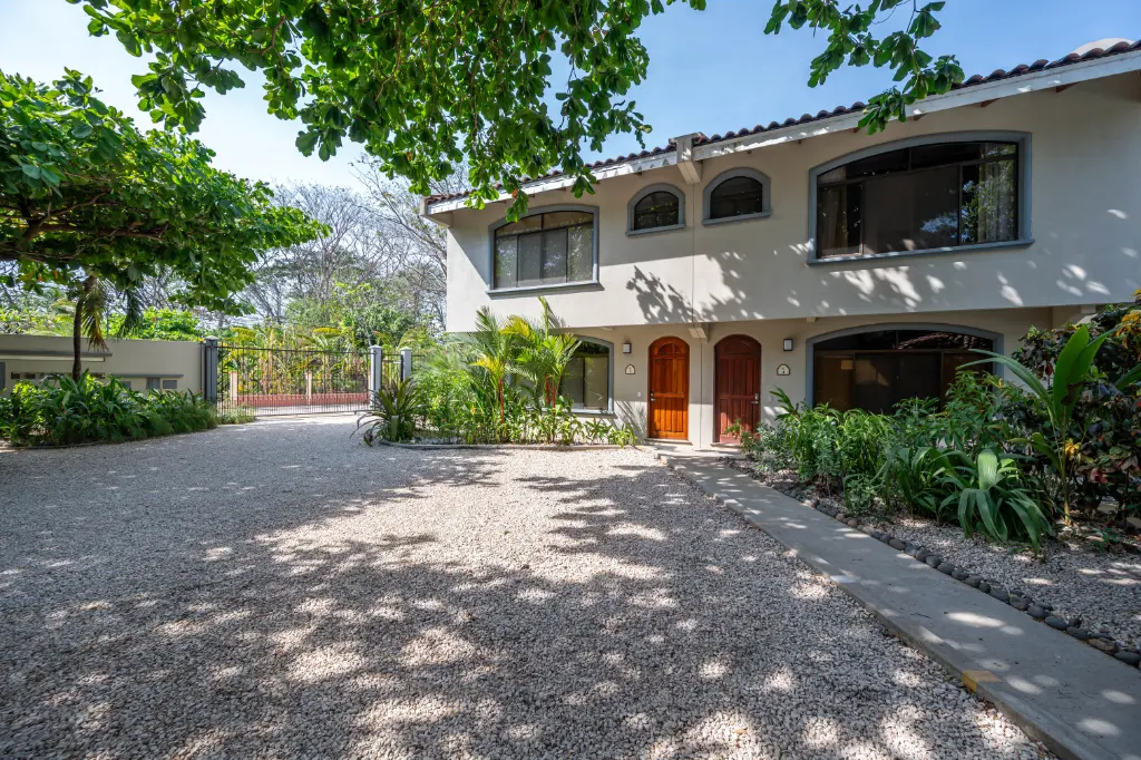 Two-story home with a garden driveway in a Guanacaste residential community