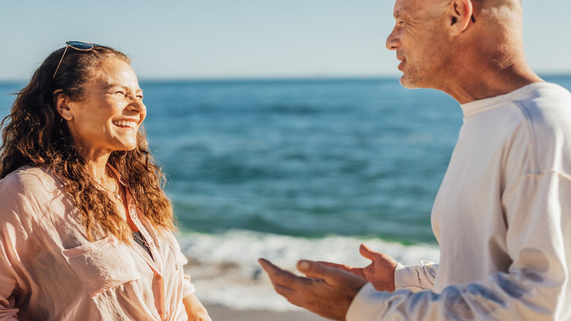 Retired couple talking beside the ocean in Costa Rica